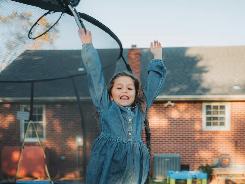 A girl jumping on a trampoline